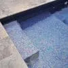 Glass mosaic tile Zafiro by Ezarri. Istalled on pool steps.