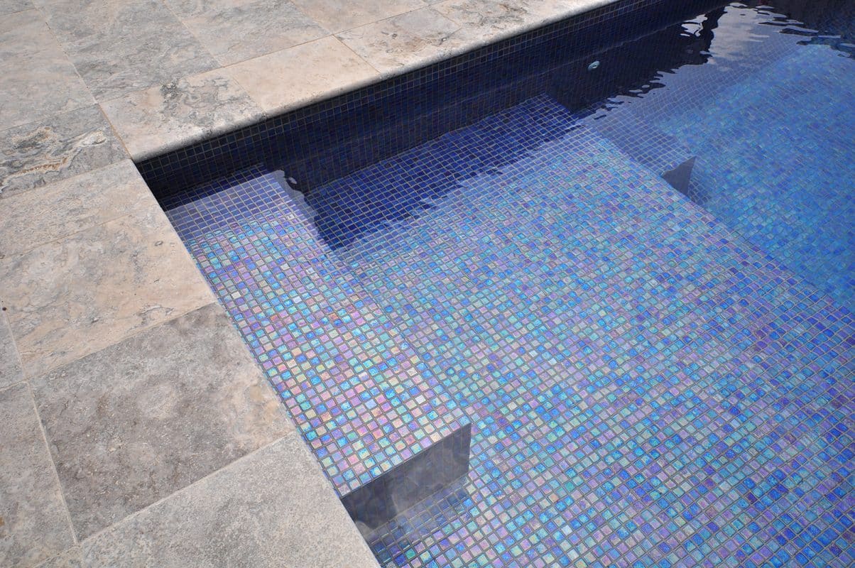 Glass mosaic tile Zafiro by Ezarri. Istalled on pool steps.