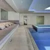 Glass mosaic tile Zafiro by Ezarri. Installed on indoor swimming pool.